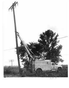 BMU line truck setting a pole.